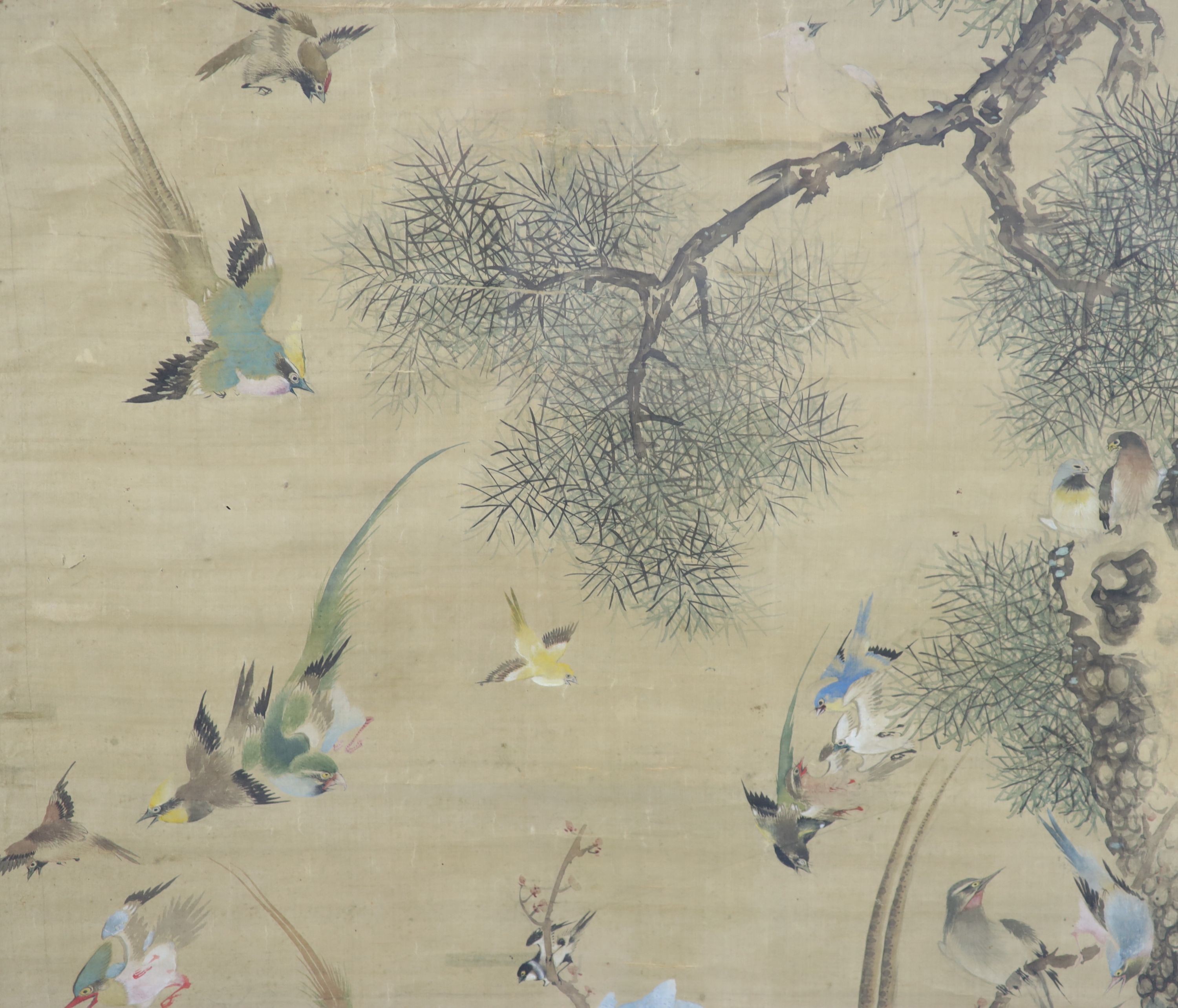 A large Chinese painting on silk of ‘The Hundred Birds’, late Qing dynasty, 161.5 cm x 91 cm including brocade border